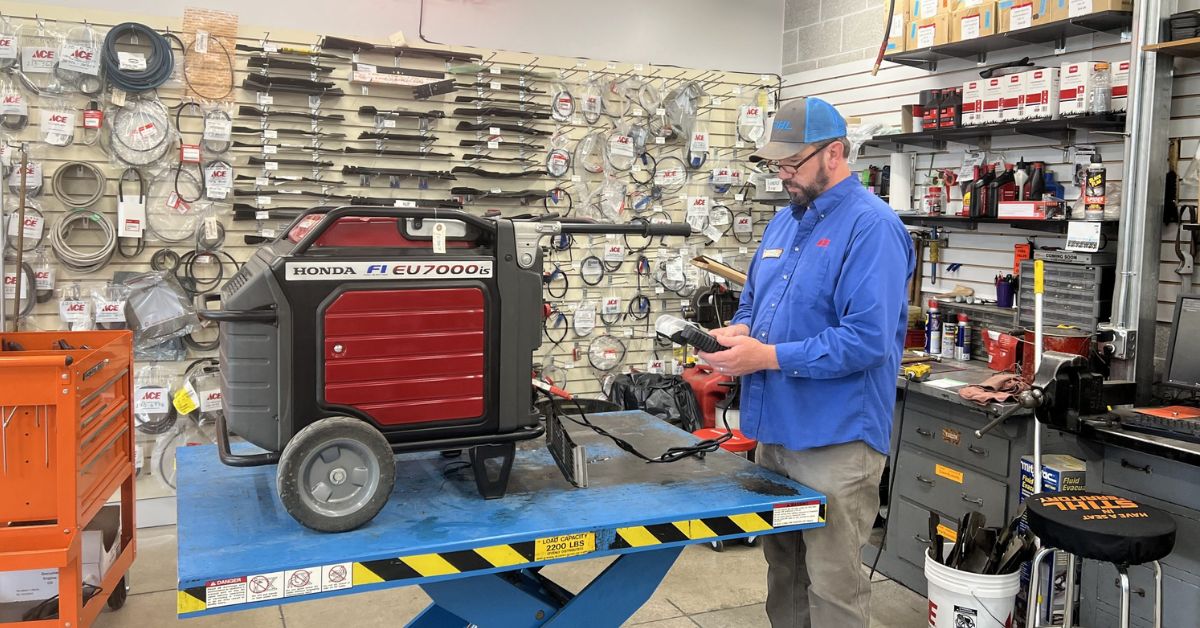 owenhouse ace repair shop mechanic working on a honda generator