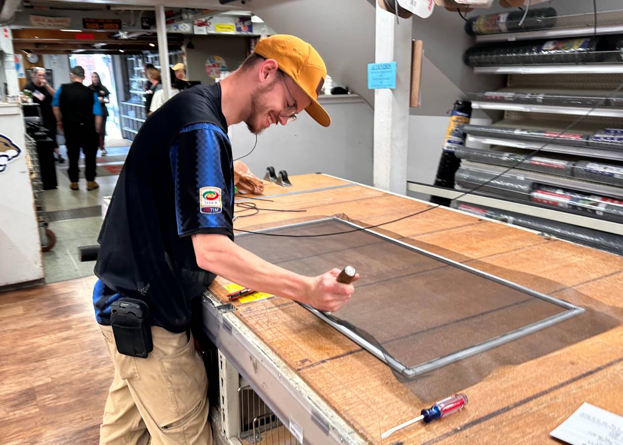 owenhouse ace hardware team member repairing a screen