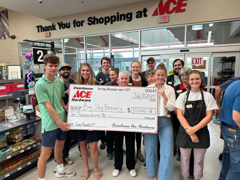 Photo of Owenhouse Team Holding Up Large Donation Check