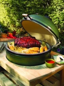 Big Green Egg cooker built into an outdoor table top