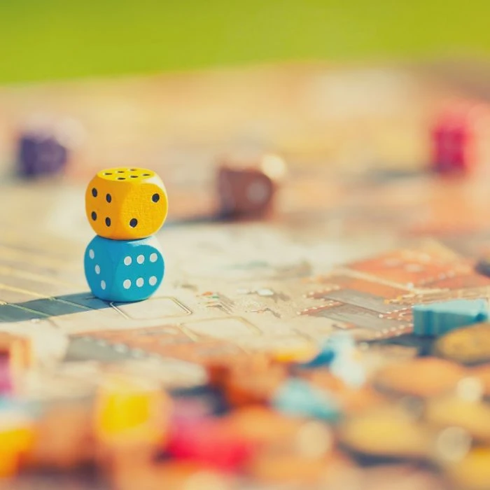 Game board with colorful dice Game board with colorful dice
