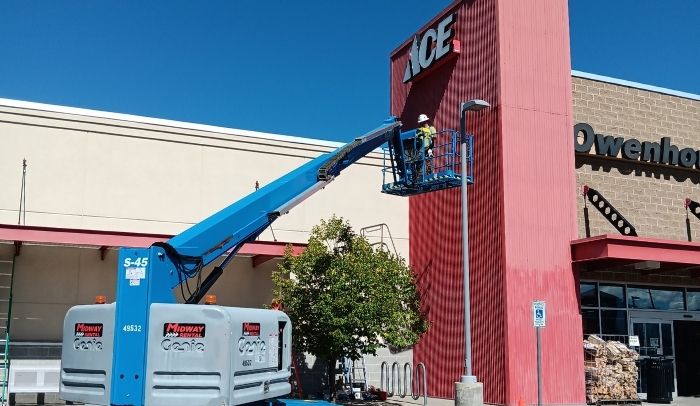 crane being used for owenhouse ace hardware west tower paint project