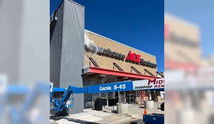 crane being used for owenhouse ace hardware tower paint project