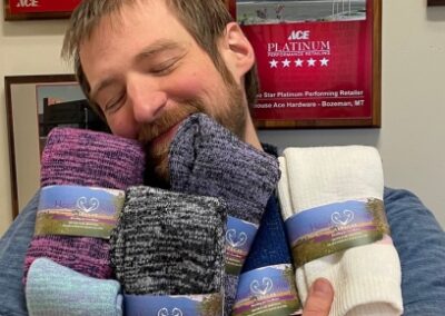 man snuggling alpaca wool socks