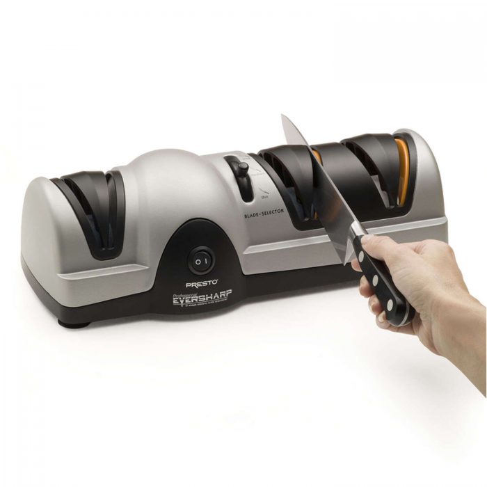 Knife sharpener with person sharpening knife